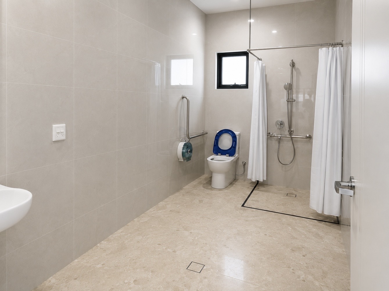 Accessible bathroom with grab rails and roll in shower